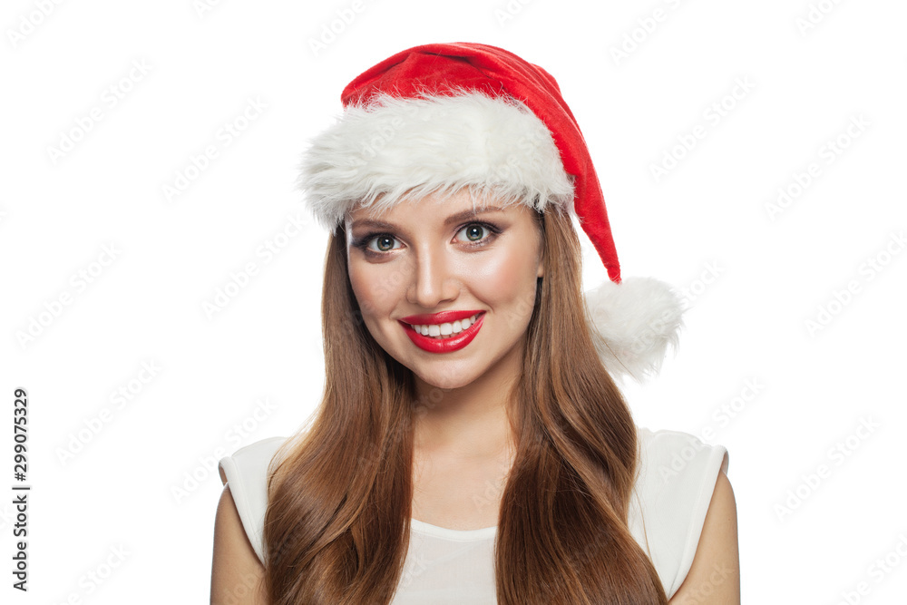 Christmas portrait of pretty young woman in Santa hat isolated on white background Christmas portrait of pretty young woman in Santa hat isolated on white background