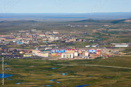 Aerial view of urban-type settlement of Ugolnye Kopi. Top view of the buildings and the vast expanses of the Arctic tundra. Location place: Ugolnye Kopi, Chukotka, Siberia, Far East of Russia. © Andrei Stepanov