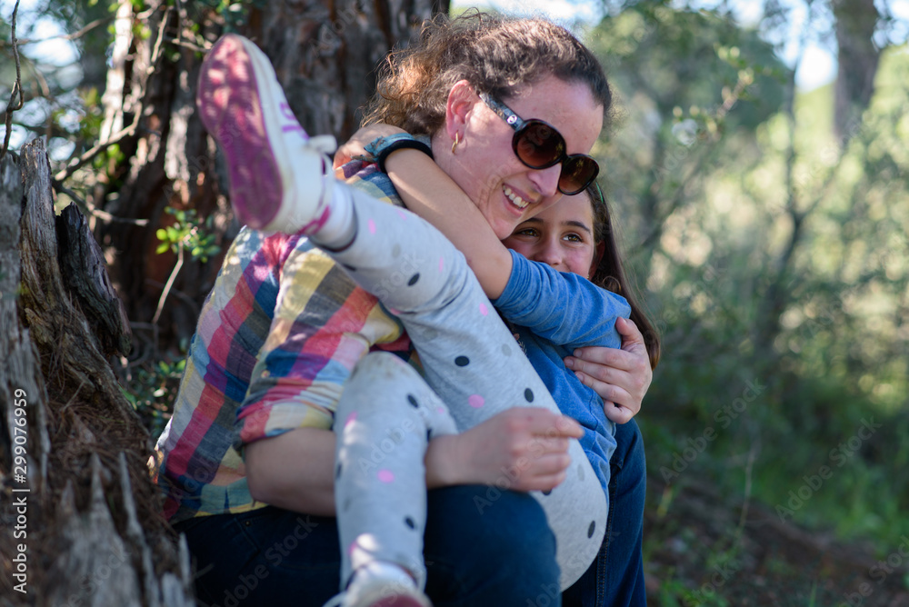 Fototapeta premium Mother and daughter playing in the field