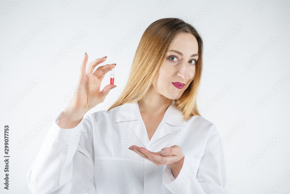 Young doctor woman in medical gown with tablets in her hand. Young doctor woman in medical gown with tablets in her hand.