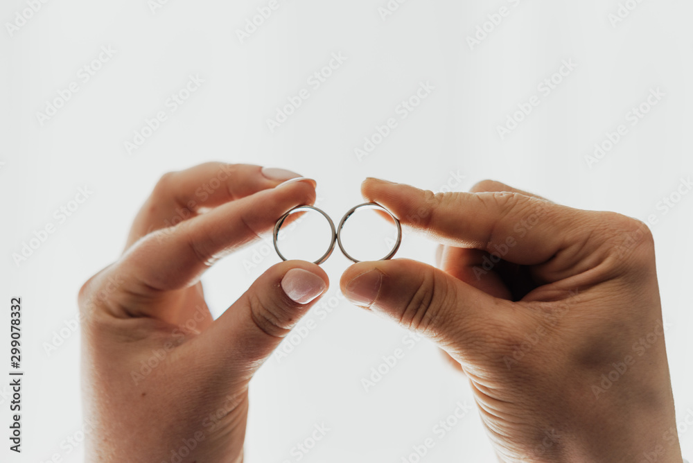 close up on wedding rings, and white background close up on wedding rings, and white background