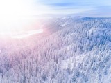 Aerial view of a winter mountains with snow covered forest in Finland
