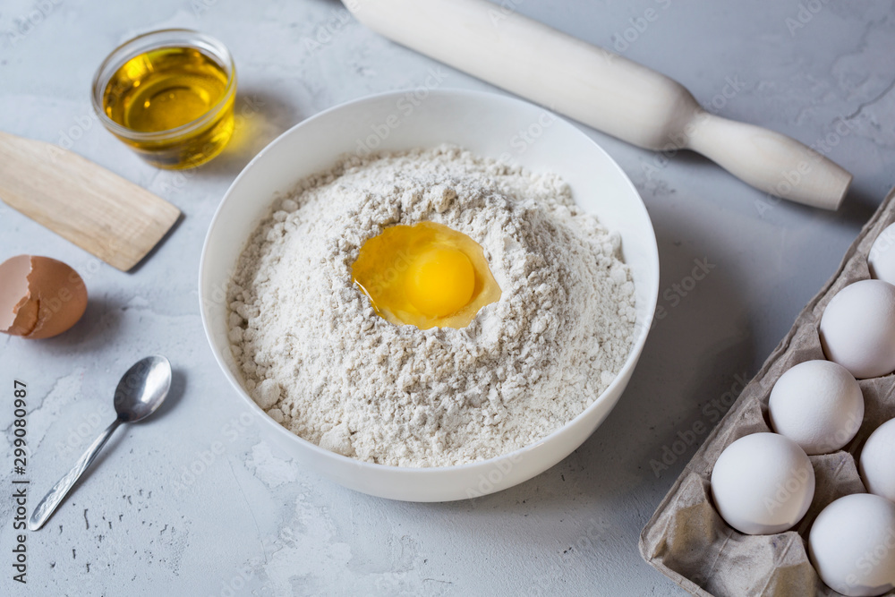 flour rolling pin and eggs on concrete background preparation for baking flour rolling pin and eggs on concrete background preparation for baking