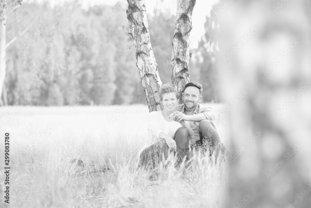 Fototapeta premium Loving family together in a park, field or woodlands