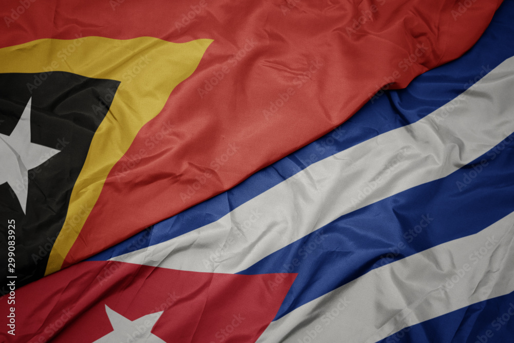 waving colorful flag of cuba and national flag of east timor.