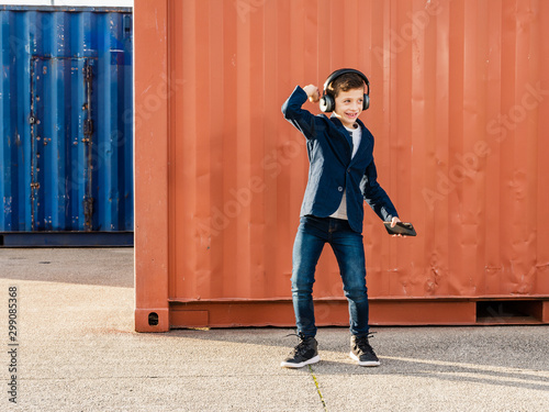 boy with headphones and mobile