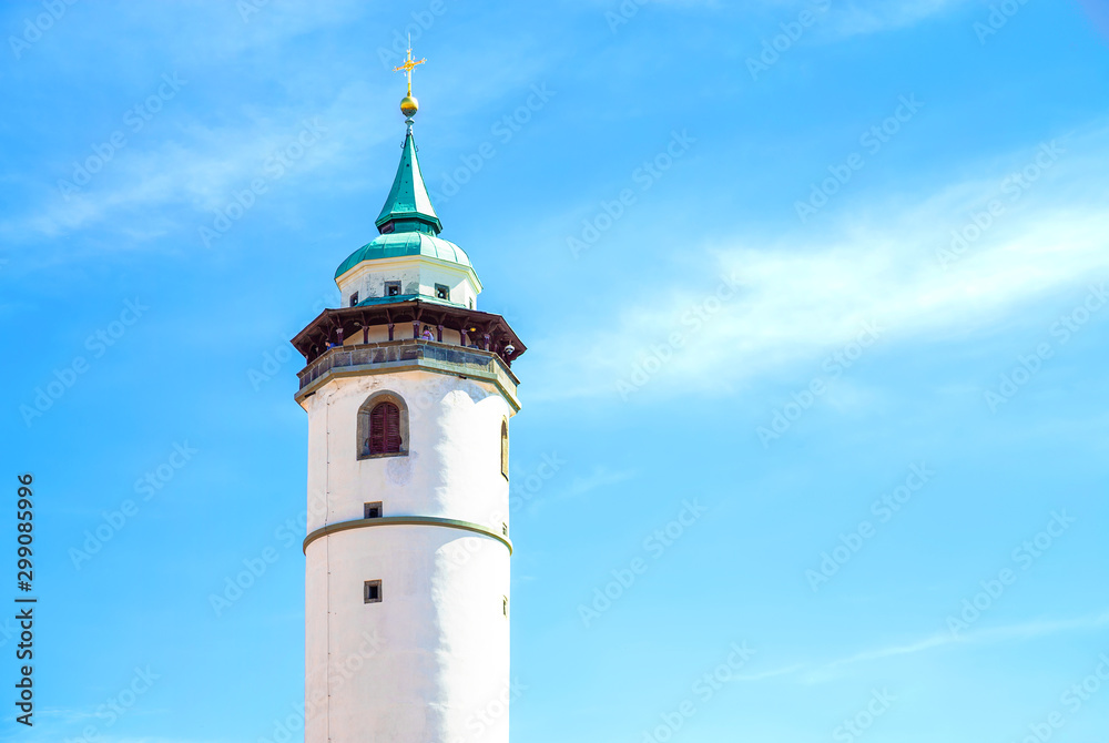 White tower in Domazlice with blue sky