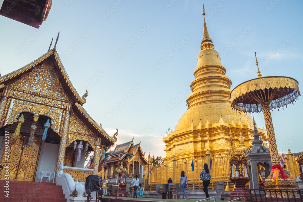 Fototapeta premium LAMPHUN,THAILAND - October 25 2019,Yi Peng Festival,Wat Phra That Hariphunchai,beautiful golden pagoda Lanna style