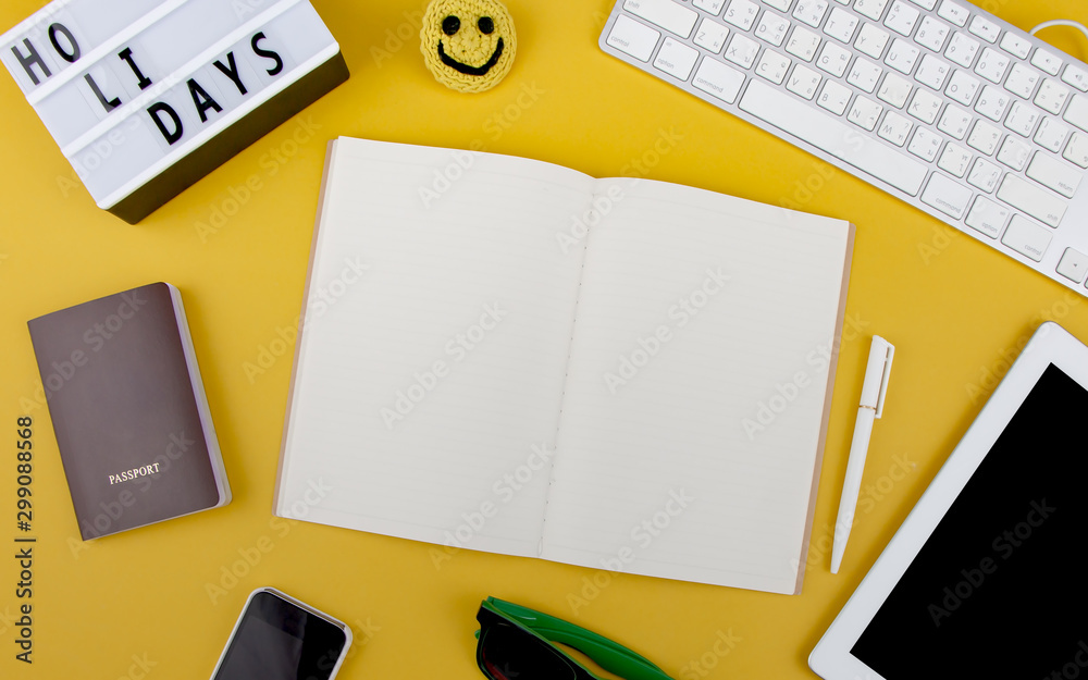 Top view of travel stuff with blank notebook for text on yellow background. Travelling, vacation and holidays concept. Top view of travel stuff with blank notebook for text on yellow background. Travelling, vacation and holidays concept.