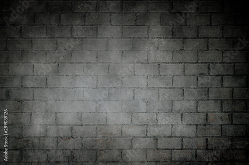 Old dark bricks wall with dark vignette borders