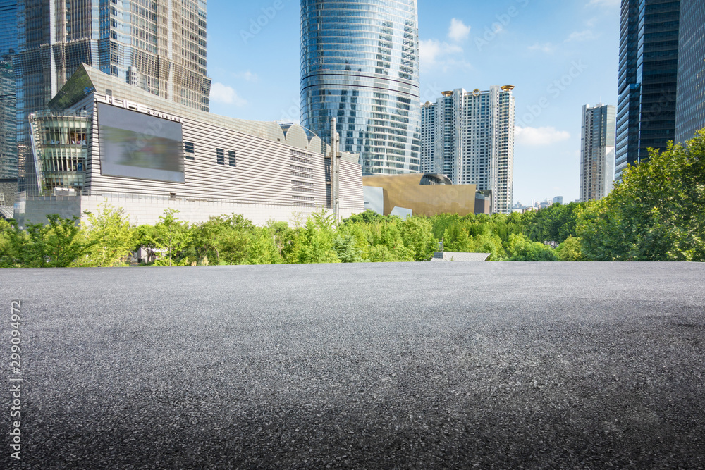 empty, modern square and skyscrapers under sunbeam