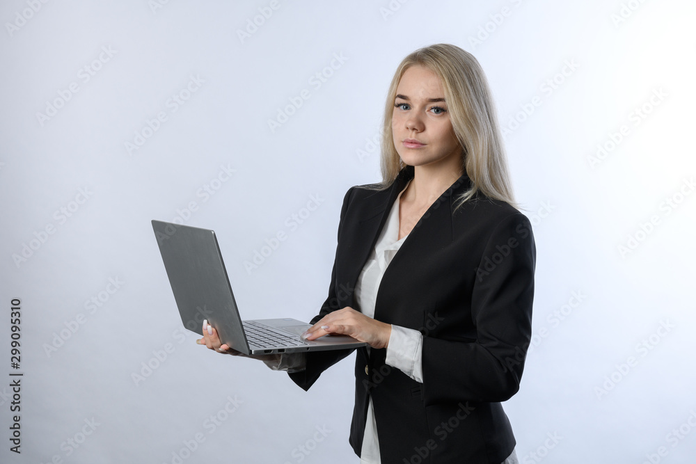 Portrait of young beautiful blonde businesswoman smiling with laptop on white background Portrait of young beautiful blonde businesswoman smiling with laptop on white background