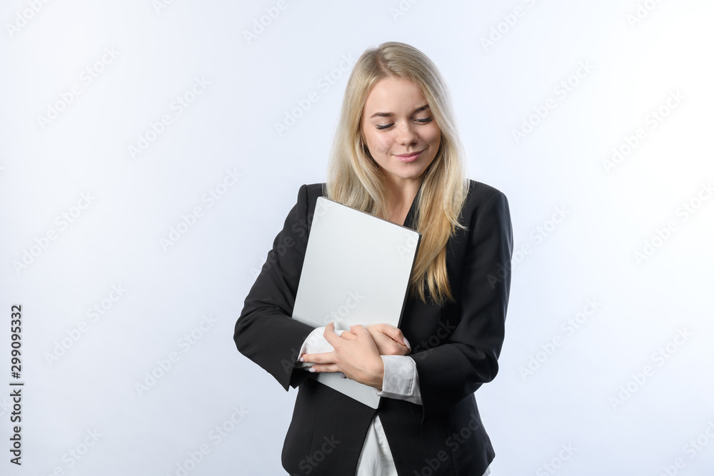 Portrait of young beautiful blonde businesswoman smiling with laptop on white background Portrait of young beautiful blonde businesswoman smiling with laptop on white background