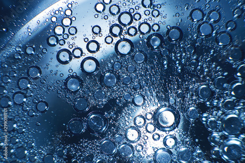 abstract light blue background with oil circles .  bubbles of water close up . oil bubbles in the water macro.  circle bubbles  background