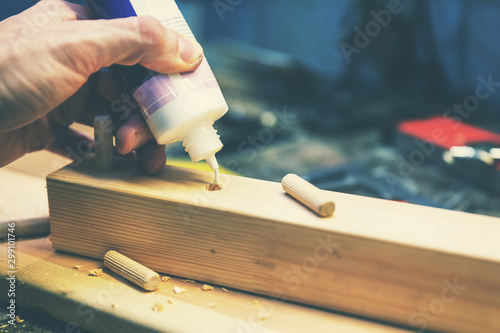 Принти на полотні wood dowel joint - joiner put the glue into a drilled wooden hole