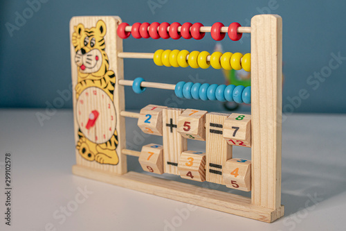 Canvas Print wooden children's abacus for children to learn math and the different hours play