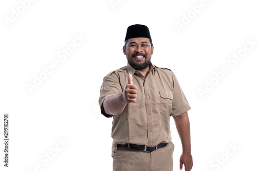 man in brown khaki uniform showing thumb up. indonesian government worker