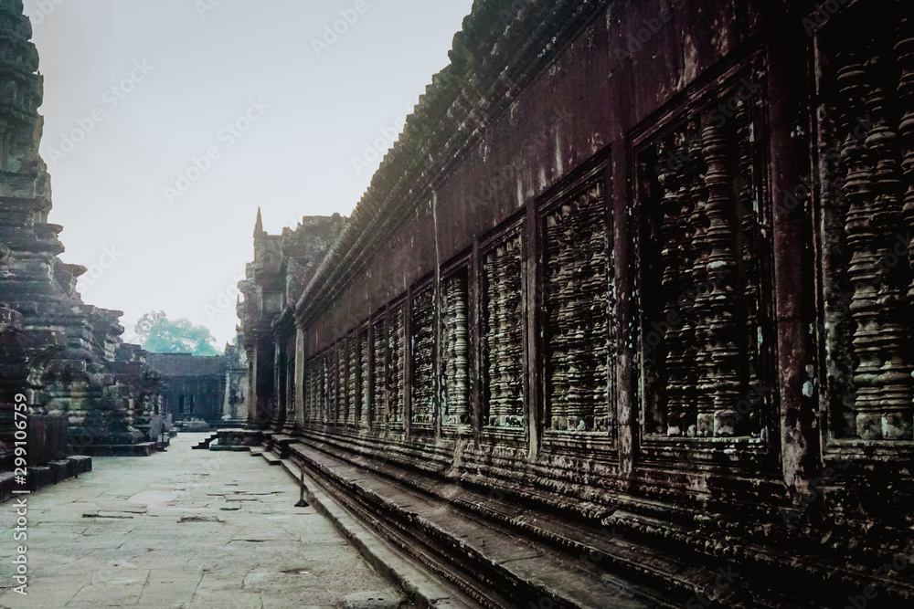 Ancient architecture and ruins of Angkor Wat early in the morning.