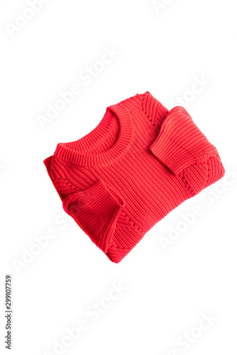Folded Red knitted sweater on white Isolated background.