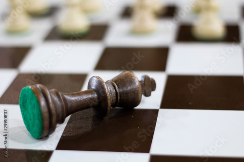 Checkmate. Black king is lying down stock photo