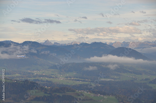 a zeppelin airship flying over the Alps seen from the Pfänder, Voralberg, Austria © SIMONE