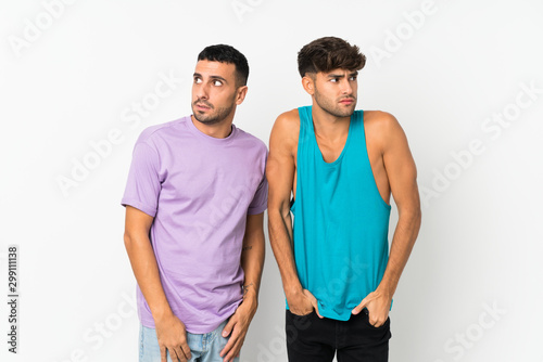 Two men over isolated background nervous and scared