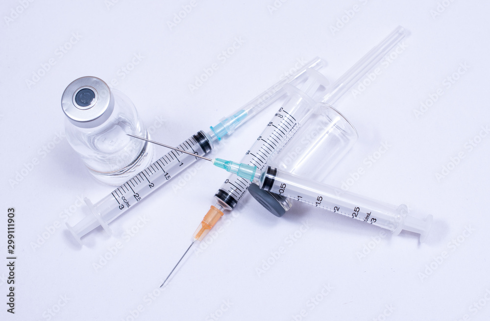 Syringe with droplet and medical on white background. Medical equipment used for surgery. Syringe with droplet and medical on white background. Medical equipment used for surgery.