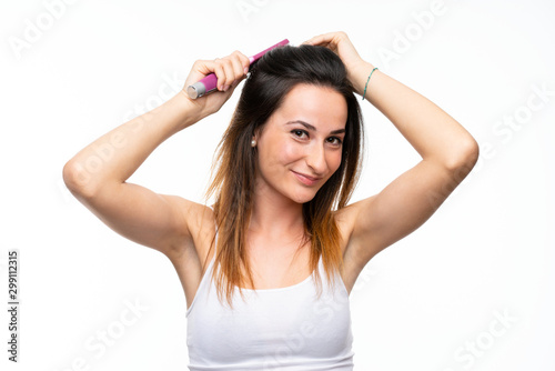 Young woman with hair comb over isolated white background