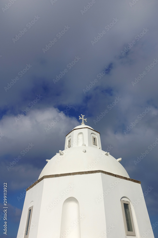 Photo from picturesque orthodox chapel in beautiful village of Fira overlooking the caldera, Santorini island, Cyclades, Greece