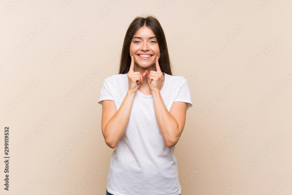 Pretty young girl over isolated background smiling with a happy and pleasant expression Pretty young girl over isolated background smiling with a happy and pleasant expression