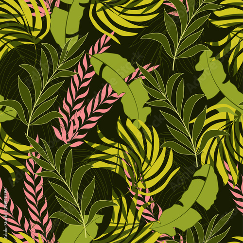 Abstract seamless tropical pattern with bright green and pink plants and leaves on dark background. Beautiful exotic plants.  Tropic leaves in bright colors. Trendy summer Hawaii print.
