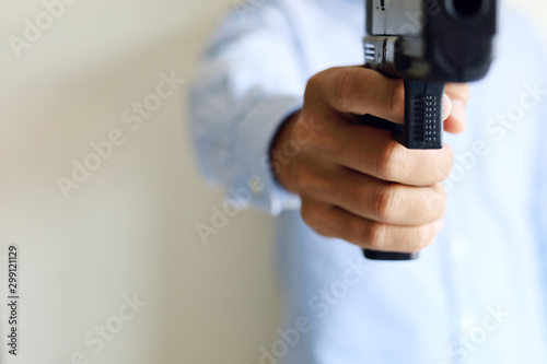 Close-up Man holding gunman concept.