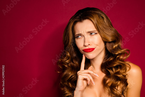 Close-up portrait of her she nice-looking attractive glamorous doubtful wavy-haired girl thinking deciding isolated bright vivid shine vibrant red maroon burgundy marsala color background