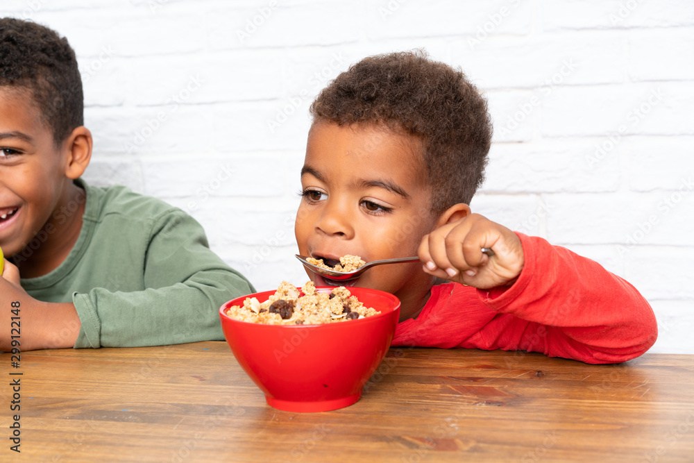 African American brothers having breakfast African American brothers having breakfast