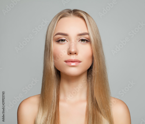 Pretty blonde model woman with long healthy blonde hair