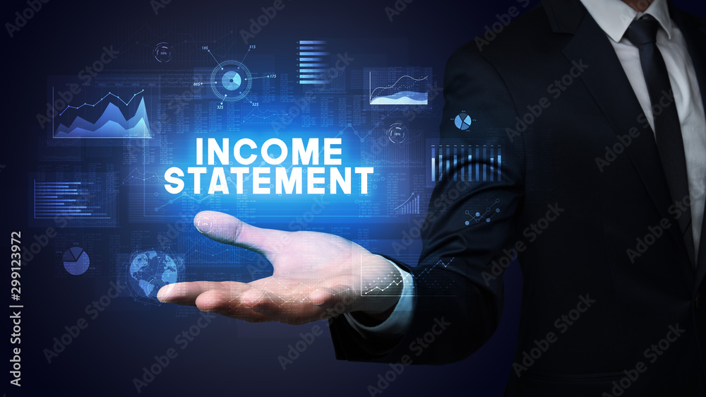 Hand of Businessman holding INCOME STATEMENT inscription, business success concept Hand of Businessman holding INCOME STATEMENT inscription, business success concept