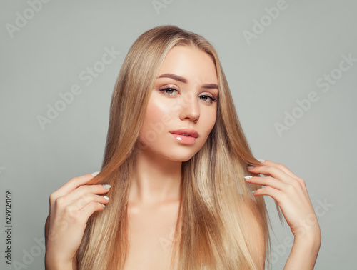 Beautiful blonde woman with long healthy blonde hair