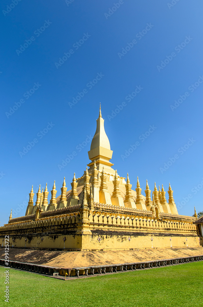 Naklejka premium Pha That Luang Temple, The Golden Pagoda in VIENTIANE ,LAOS PDR. The most famous landmark of LAOS. Layout for magazine, ads.