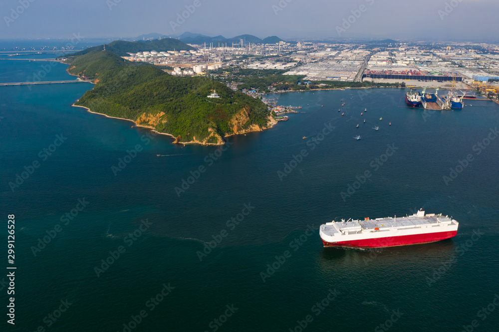 Aerial view of the ship loading new cars. Automotive container carriers oversea services. Transportation business for prefabricated cars by sea freight...