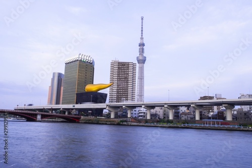 Famous landmark of Japan, near Sumida river , Tokyo sky tree and Asahi tower in blue sky evening time