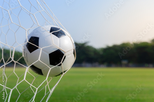 Soccer ball in goal, sport and success business concept.