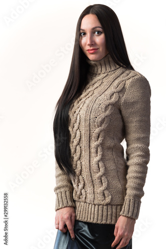 Stylish young woman in a knitted sweater