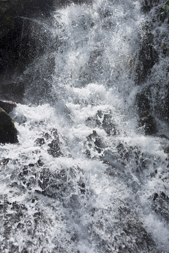 spray and jet of a waterfall
