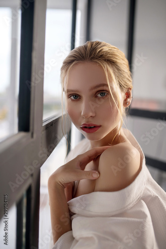 Free Download Beautiful woman having open shoulder standing near door - GFXLoad