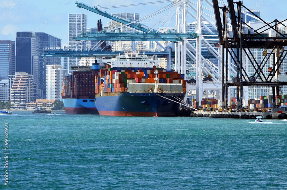 Two container ships off loading cargo at the Port of Miami