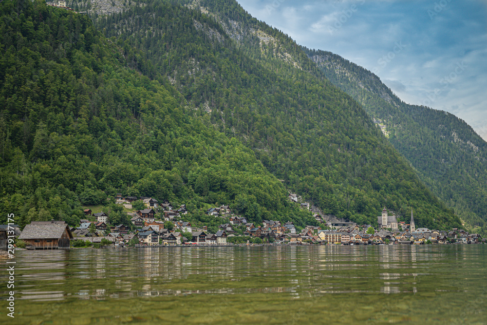 View on lake in austrian town hallstatt during tourist season in summer