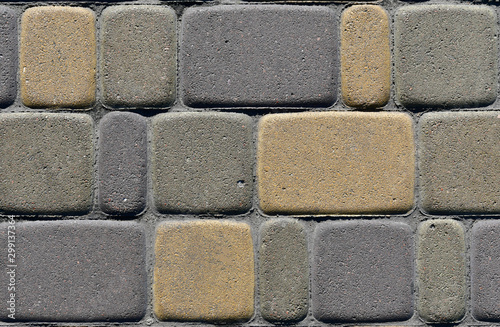 Texture of multicolored pavers on the road. Background