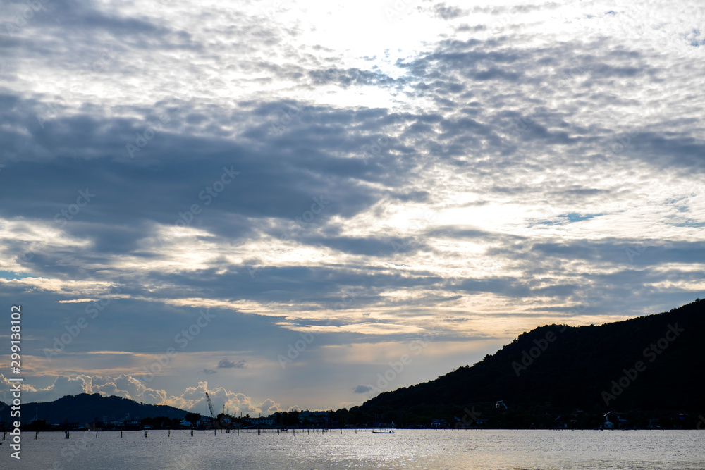 The sea the evening amidst the clouds and the sky is beautiful quiet atmosphere feeling lonely The sea the evening amidst the clouds and the sky is beautiful quiet atmosphere feeling lonely