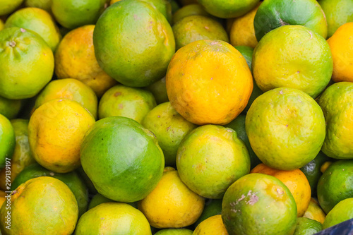 Heap Bunch Bundle of Oranges Fruit Fresh From Farm Yellow and Green Color in Market Decoration and Sale Close Up
