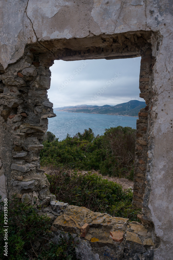 Window in ruins with views of the mountain and the sea of natural park of Algeciras